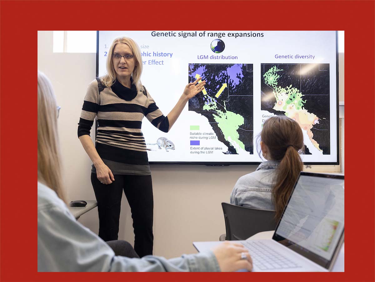 Tereza Jezkova points to a map on a digital screen 