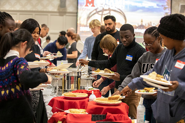 International and other students at a Thanksgiving buffet line at Shriver Center