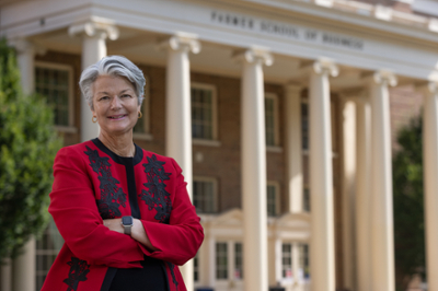 new dean in front of business school