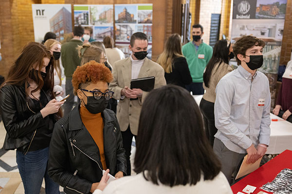 students in alumni hall for career fair