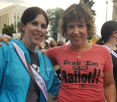 Kimberly Hamlin, right, and a friend protest Roe v. Wade being overturned while they were in Denver at the League of Women Voters' National Convention.