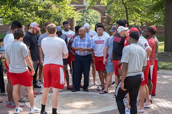 Rodney Coates with student athletes at the Seal