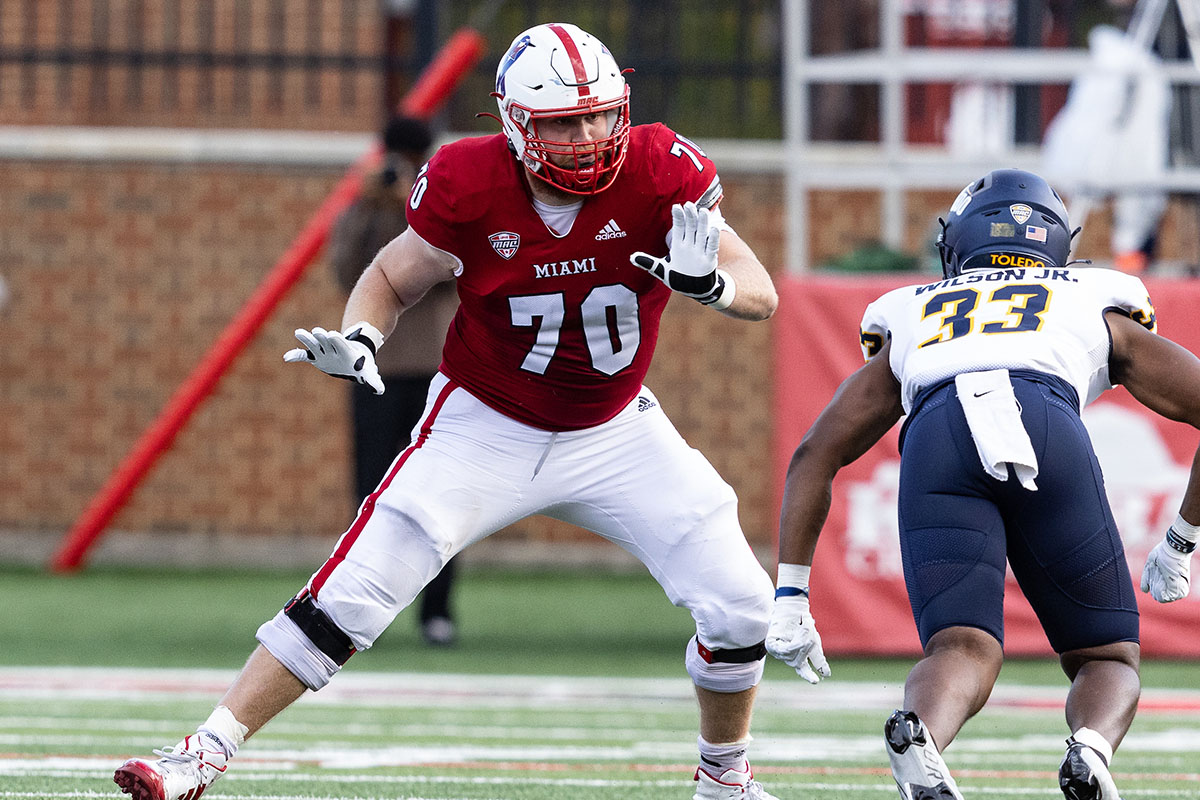 Miami's Will Jados (70) blocks