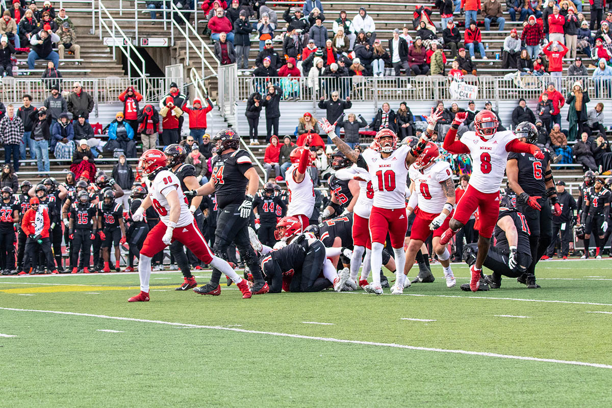 Miami football celebrates after a play