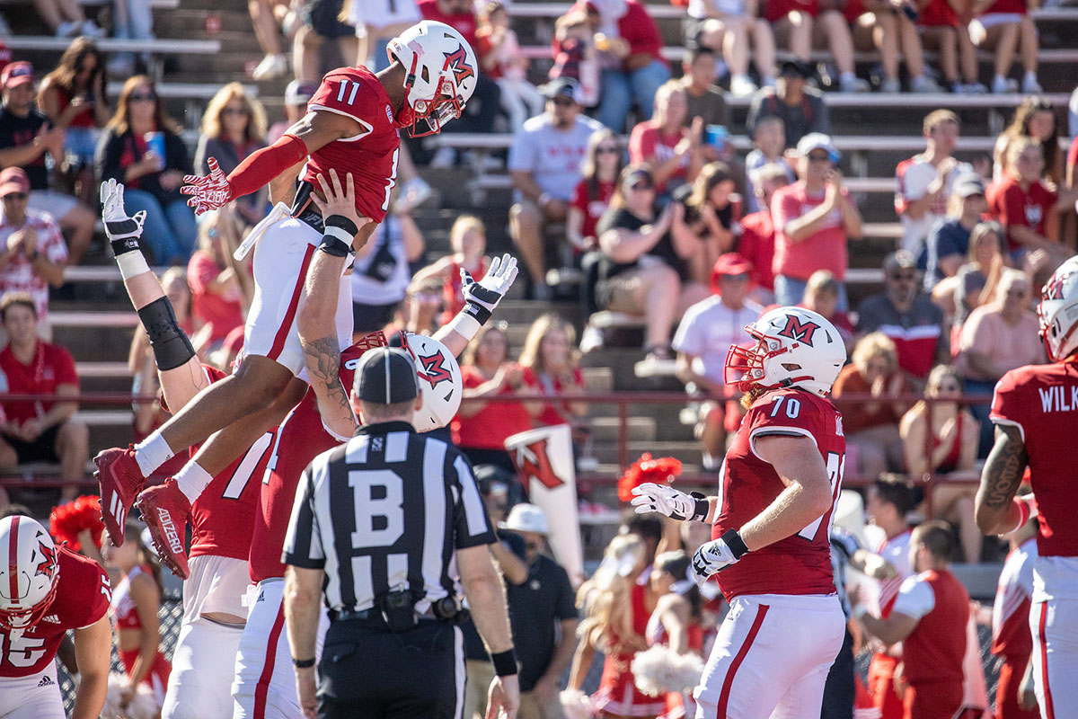 Javon Tracy (11) celebrates a touchdown at Yager Stadium