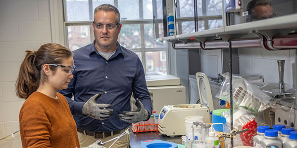 Rick Page, right, associate vice president of research and innovation, talks to a student