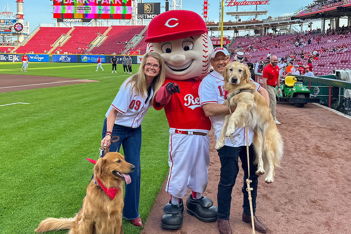 Newton, Miami University Ambassador Dr. Renate Crawford, Cincinnati Reds mascot Mr. Red, Miami President Gregory Crawford, and Newton pose for pictures on April 30.