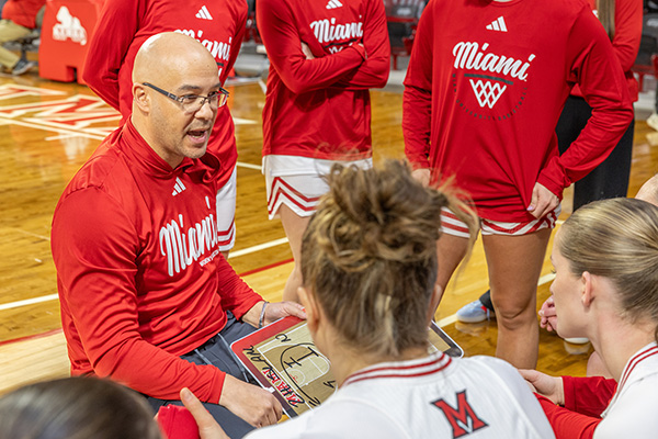 Coach Glenn Box talks to his team during a break in the action (photo by Scott Kissell).