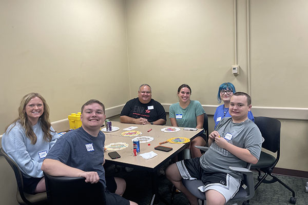 Lunch Bunch activities include coloring, games, and a pizza party. The Lunch Bunch initiative started at Miami University in 2023.
