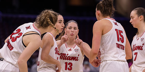 Tamar Singer, center, and the Miami University women's basketball team